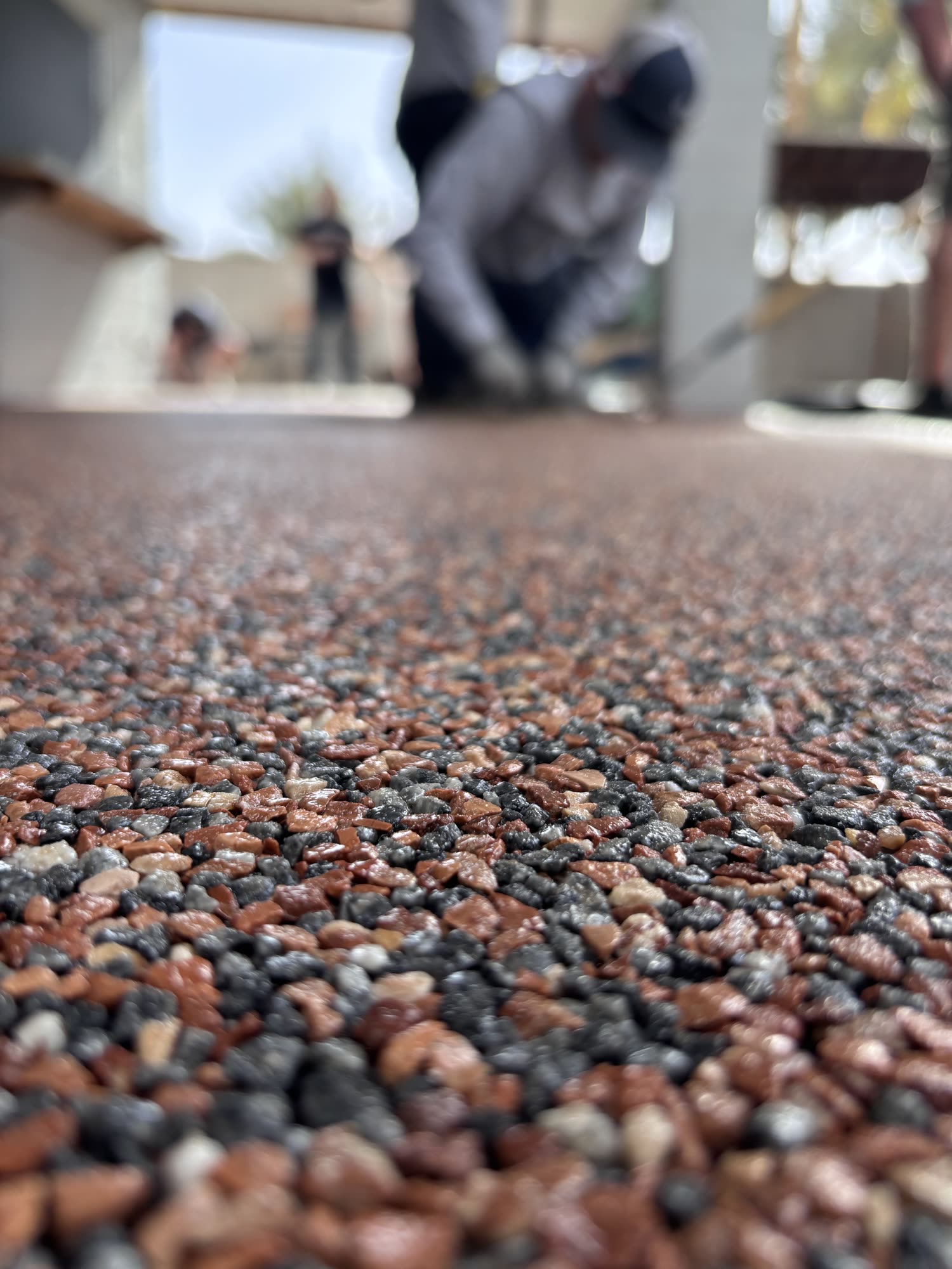 Close-up of red, gray and cream stone in a Vuba Stone surface